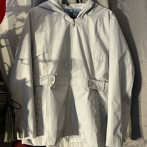 It is a zip up jacket, the brand is Gallery, its blue,
